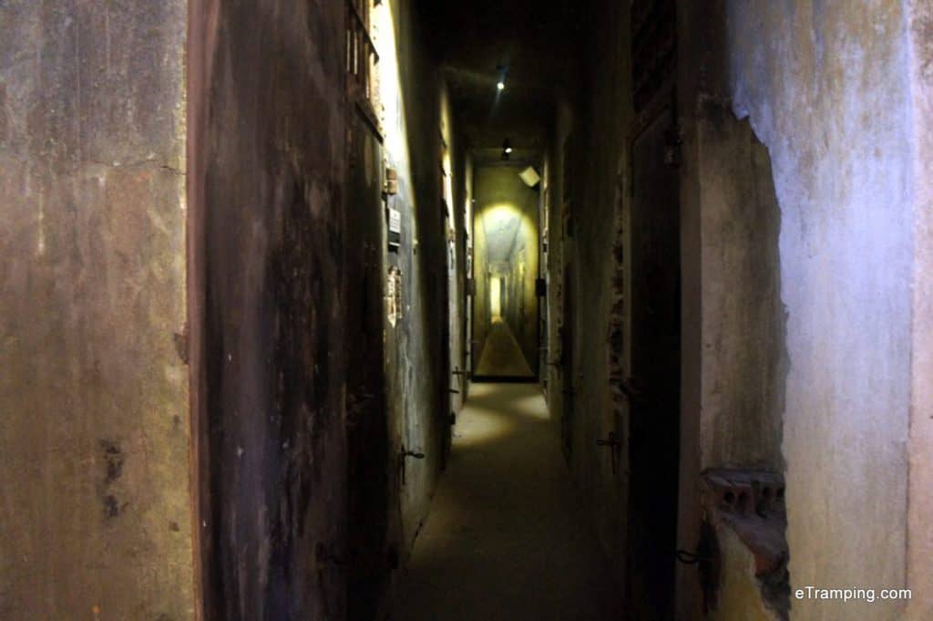 A claustrophobic and dark hallway used to house former prisoners.