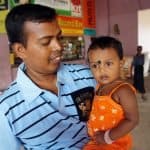 Sri Lankan man is holding his child