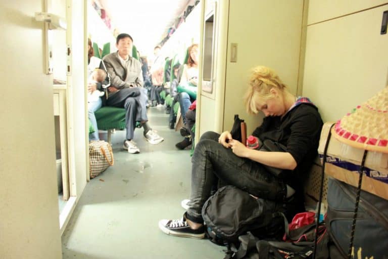 Agness sleeping on the floor on the train