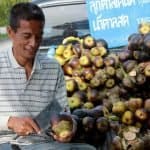 Locals selling tropical fruits