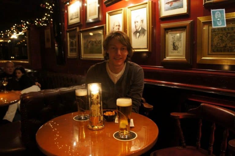 A Dutch guy sitting in a bar drinking a beer