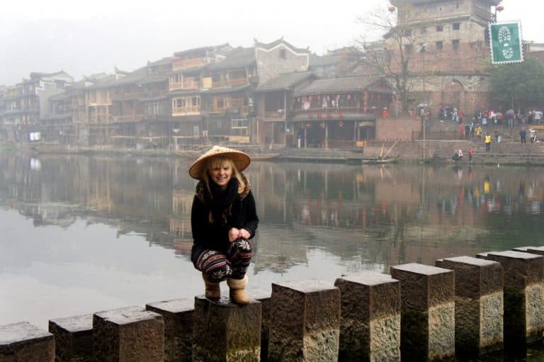Fenghuang a girl is standing on the bridge