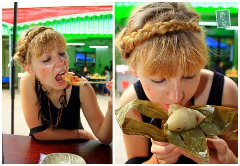 A girl is eating jiaozi and smelling sticky rice