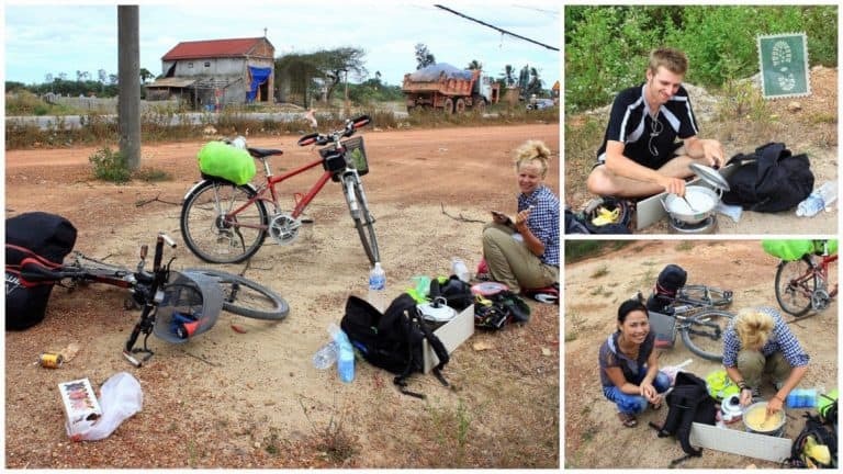 Three people are cooking on the road with bike in Vietnam