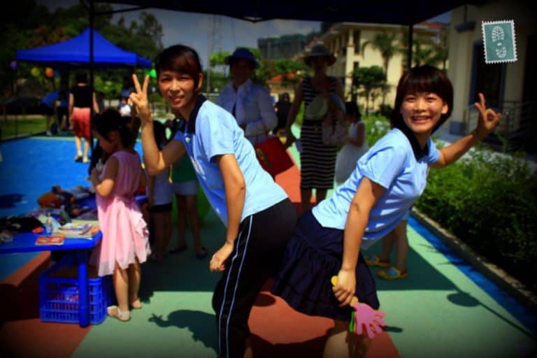 Two Chinese girls are posing for a photo