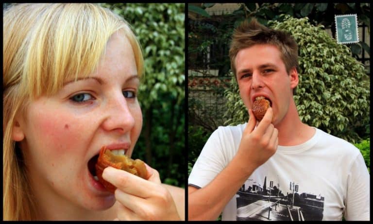  A girl and a boy are eating Chinese mooncake