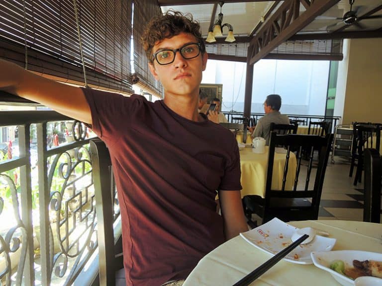 A guy is enjoying a Thai breakfast