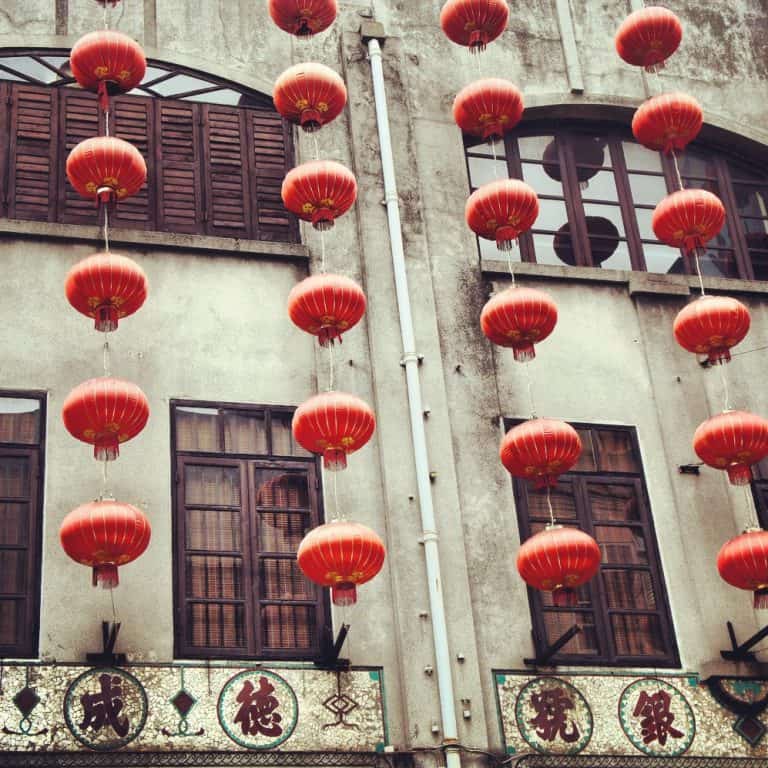 Chinese lanterns hanging on Macau buildings.