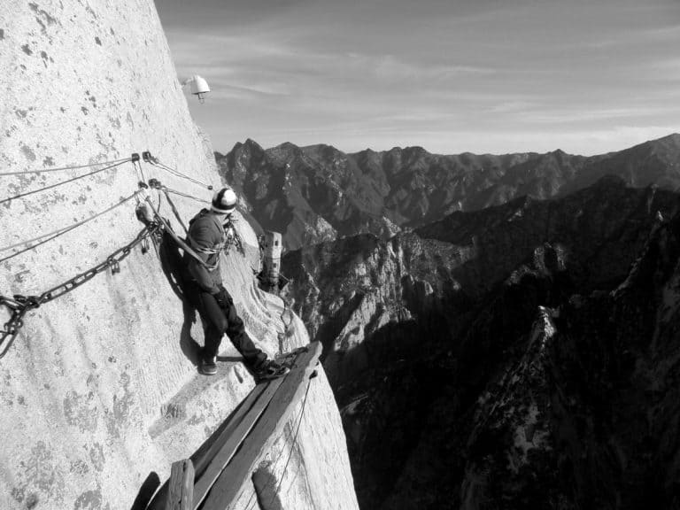 A guy climbing mountains