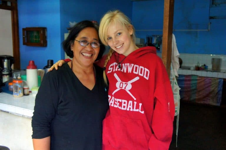 A girl smiling with a woman