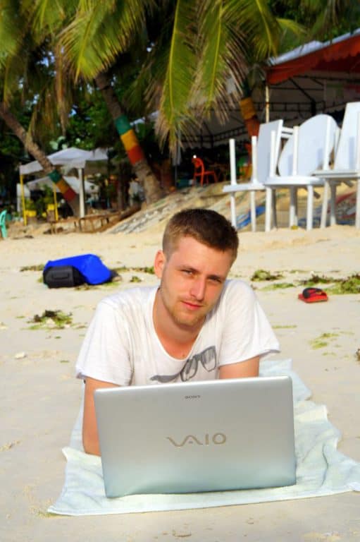 Cez blogging at Alone Beach, the Philippines