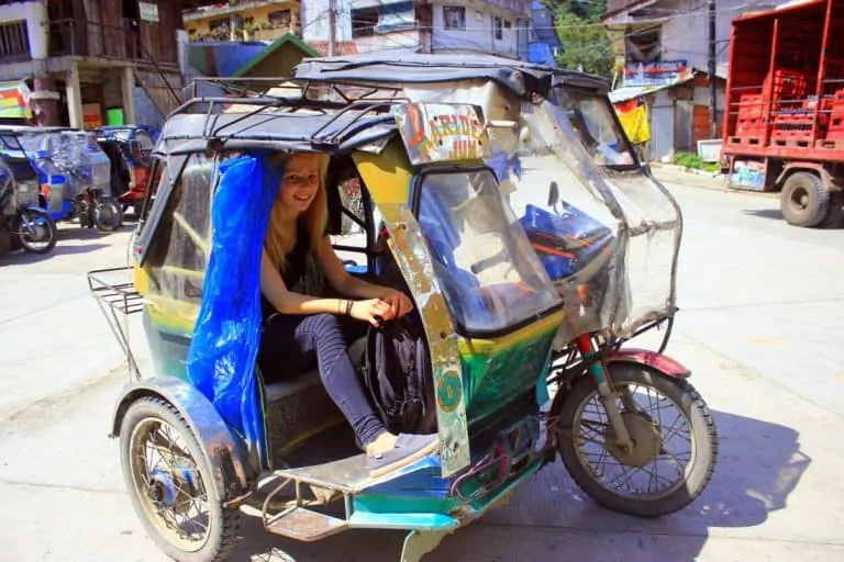 A girl in a tricycle