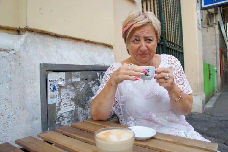 Woman tasting Caffé Corretto