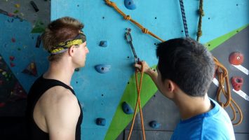 Learning how to correctly clip in while lead climbing