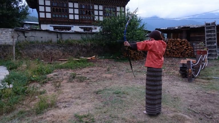 Lydia trying the national sport of Bhutan