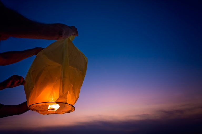 People Setting Off Chinese Lantern During Mid Autumn Festival