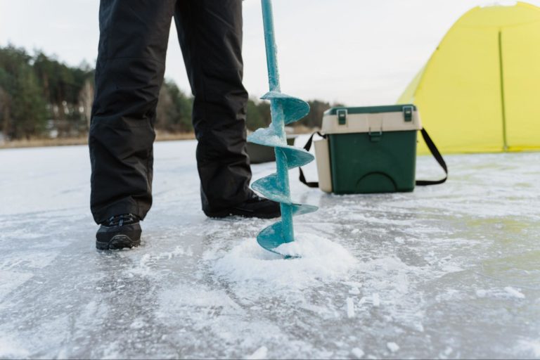 Power augers or chisels are essential for drilling holes in the ice.