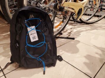 black backpack with blue string cord