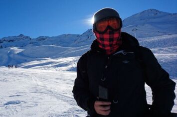 black winter jacket in mountains everest with face mask