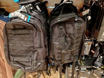 grey backpacks in store