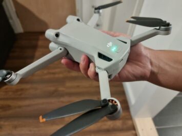 holding up a charged drone