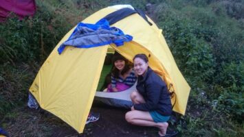 small yellow tent simple camping with women
