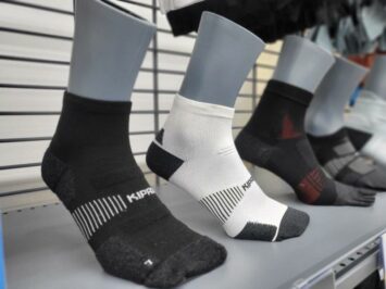 rows of black and white socks mannequin store