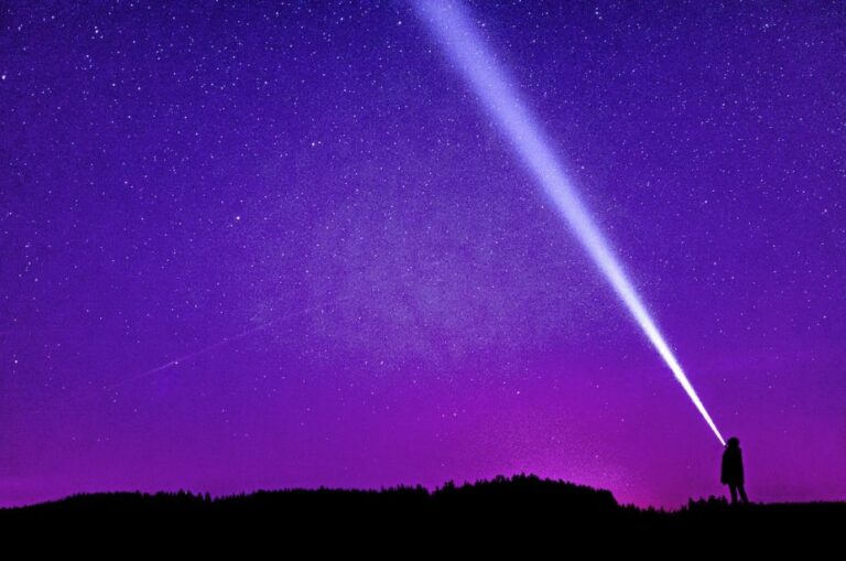 flashlight in purple sky