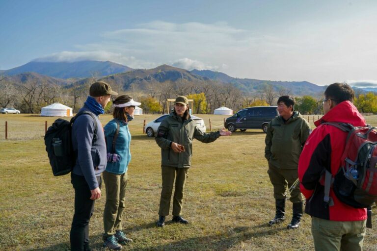 tour guide explaining to pair in Mongolia