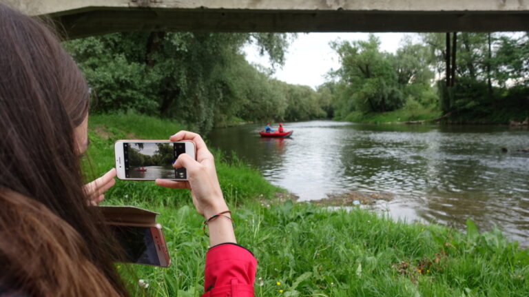 taking a picture of a boat ride while travelling overseas